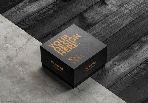 Black square box mockup packaging on the floor side view