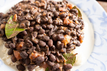 Rice and beans on a white and blue plate