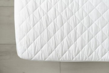 closeup of mattress with textile cover, healthy sleep concept