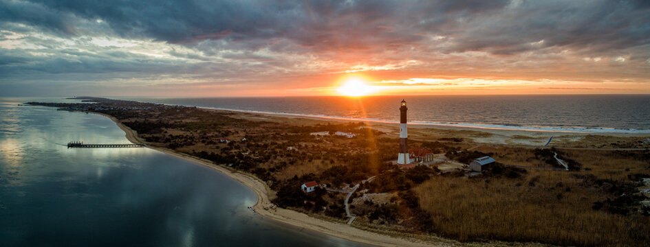 A scene of the beach area on the southern shore of Long Island NY at dawn..  Scenic overview of the Long Island sound on the left and the Atlantic Ocean on the right.