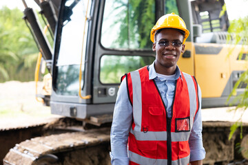 Portrait african american young Male construction worker operating on Skid tractor or construction...