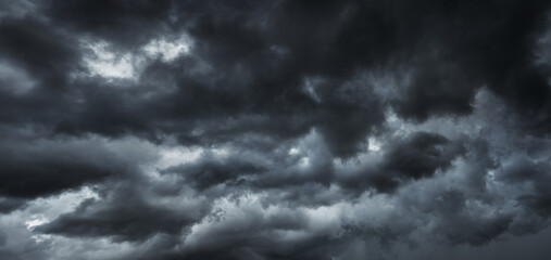 dark clouds make sky in black. Heavy rain thunderstorm. Pattern of clouds overcast predict tornado,...