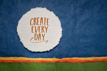 create every day - inspirational reminder or advice, handwriting on a circular sheet of watercolor paper against abstract landscape, creativity and personal development concept