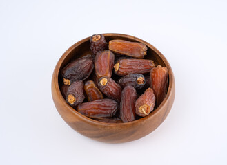  Ramadan Dates Palm Fruit On A Wooden Plate On isolate White Backgorund.