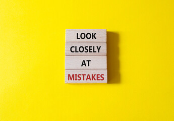 Look closely at mistakes symbol. Wooden blocks with words Look closely at mistakes. Beautiful...
