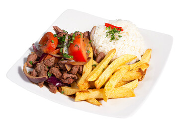 Peruvian traditional food. A beef with tomatoes, onion, rice and fried potatoes, Lomo saltado
