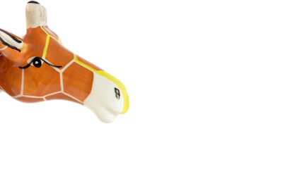 Ceramic giraffe head sculpture isolated on white background.