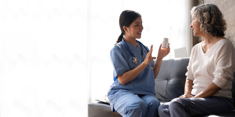 Fototapeta na wymiar Young nurse advise and give advice medicines are given to patients in the examination room of a hospital or clinic, Medical service