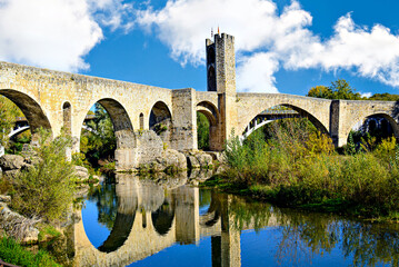 Famous medieval bridge over the river Fluvia in the medieval village de Besal&uacute;, Girona, Catalonia, Spain	