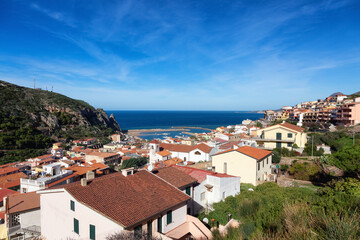 Fototapeta na wymiar Town on the sea coast, Buggerru, Sardinia, Italy. Sunny Fall Season Day.