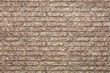 The texture of a brick wall with a decorative chocolate-colored protective coating.
