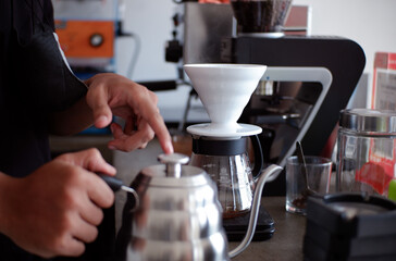 Fototapeta na wymiar pour water into coffee using the v60 method