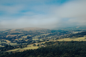 clouds over the Peak District hills