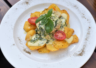 Baked potatoes with salad on a plate