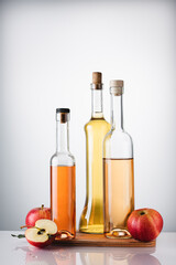Obraz na płótnie Canvas Bottled apple cider vinegar and fresh apples.