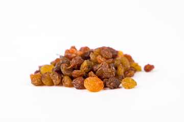 Heap of raisins on white background. Close up.