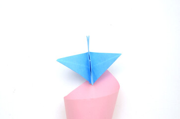 Origami crane and paper cone, top down
