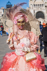 People wearing elaborate and colorful costumes and masks during the Venice 2023 carnival in Venice,...