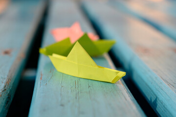 origami paper sailboat sailing on blue water, origami boat sailing in blue ocean , paper art style