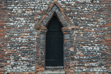 The doorway of a church is Colchester, Essex made with re-used Roman tiles.