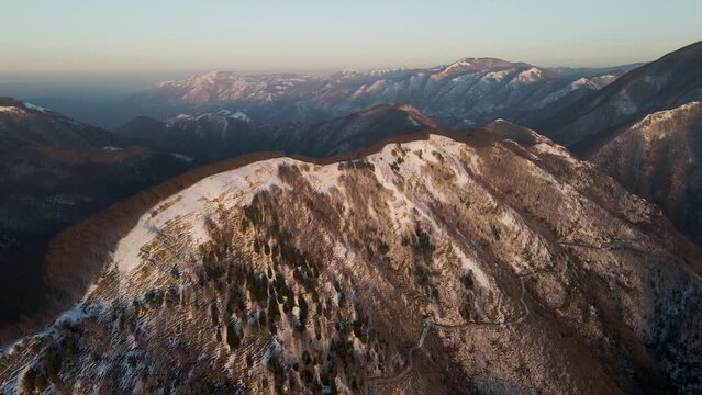 Aerial view of Mount Terminio peak with snow in wintertime, Serino, Avellino, Irpinia, Campania, Italy.