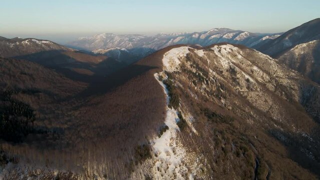 Aerial view of Mount Terminio peak with snow in wintertime, Serino, Avellino, Irpinia, Campania, Italy.