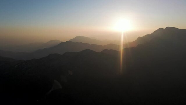 Aerial view of a mountain landscape at sunset in winter from Mount Terminio, Serino, Avellino, Irpinia, Campania, Italy.