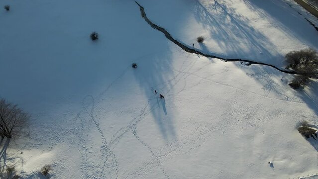 Aerial view of people on Ischia Plateau with snow in wintertime on Mount Terminio, Serino, Avellino, Irpinia, Campania, Italy.