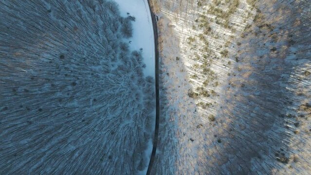 Aerial view of a forest road in winter on Mount Terminio, Serino, Avellino, Irpinia, Campania, Italy.