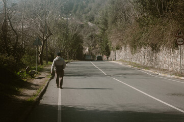 Man walking alone on a road in kanlica Istanbul, turkey
