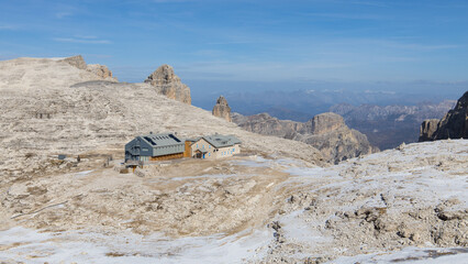 The mountain hut Refugio Boè in the Dolomites mountains on a beautiful late autumn day