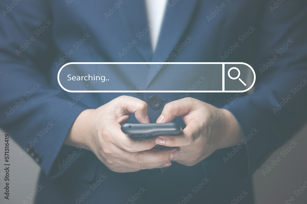 Wall mural businessman hand typing on smartphone with bar tool to search for information using for your website