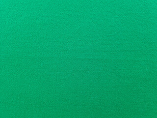 Texture of felt fabric in dark green color for background