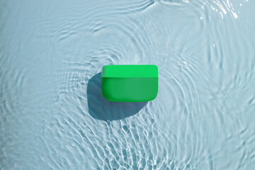 Water ripples on blue background. Ocean waves effect from top angle.