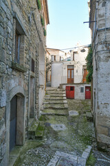 A narrow street between the old houses of Bovino, an ancient town in Puglia, Italy.