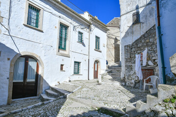 A narrow street between the old houses of Bovino, an ancient town in Puglia, Italy.