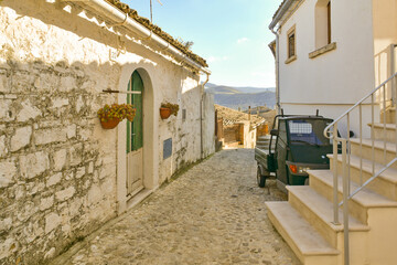 A narrow street between the old houses of Bovino, an ancient town in Puglia, Italy.