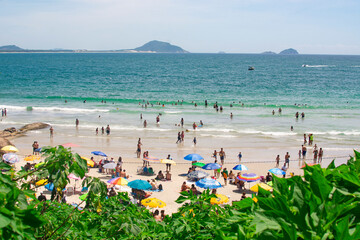 FLORIANOPOLIS, BRAZIL - JANUARY 21, 2023 : crowded beach Praia da Barra da Lagoa in Florianopolis,...