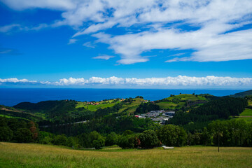 Landscape overlooking the green hills and the Atlantic Ocean. Coast of Basque Country, Spain