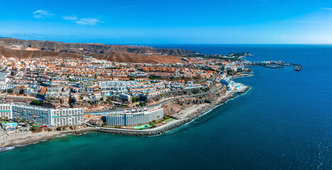 Fototapeta na wymiar Beautiful aerial landscape with Anfi beach and resort, Gran Canaria, Spain. Luxury hotels, turquoise water, sandy beaches in Spain. Luxury beach vacation concept. Heart shaped island.