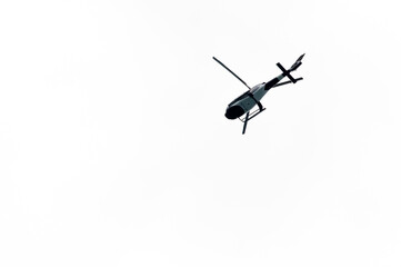 Helicopter Flying in the sky on a white background for design as a security concept and surveillance