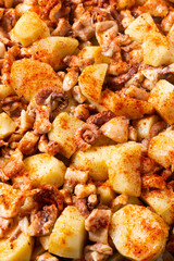 Close-up of Galician style octopus. Traditional Spanish food. Mediterranean cuisine. Pattern. Background