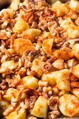 Close-up of Galician style octopus. Traditional Spanish food. Mediterranean cuisine. Pattern. Background