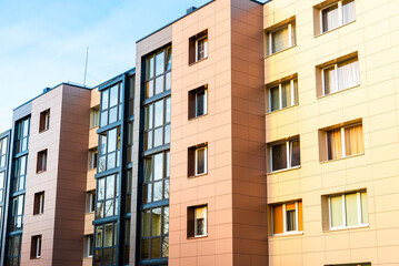 Renovated and renewed complex of blocks of flats.Building has colorful facade. Restored old apartment building from the 80s.