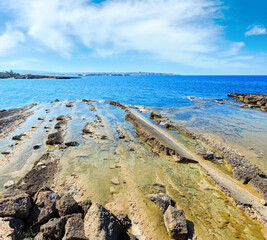 Stone geological structures on Massolivieri  summer sea coast  (Siracusa, Sicily, Italy)