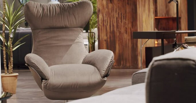 Close Up Fabric and Textil modern brown armchair in living room. Modern Minimalist Home. Elegance and Comfortable Home, Warm cozy. Modern beige armchair. Interior Detail.