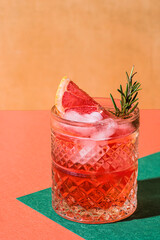 Red cocktail in base of Campari or bitter with blood red oranges (tarocco) on the geometric ...