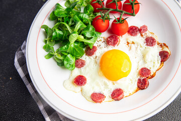 breakfast fried egg sausage, vegetable fresh meal snack on the table copy space food background rustic top view