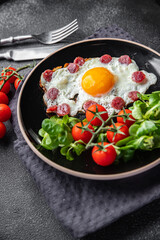 breakfast fried egg sausage, vegetable fresh meal snack on the table copy space food background rustic top view