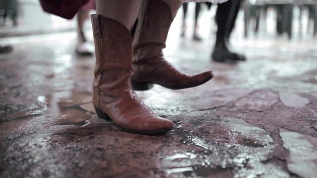 Close up of a woman practicing tap dance wearing classical boots